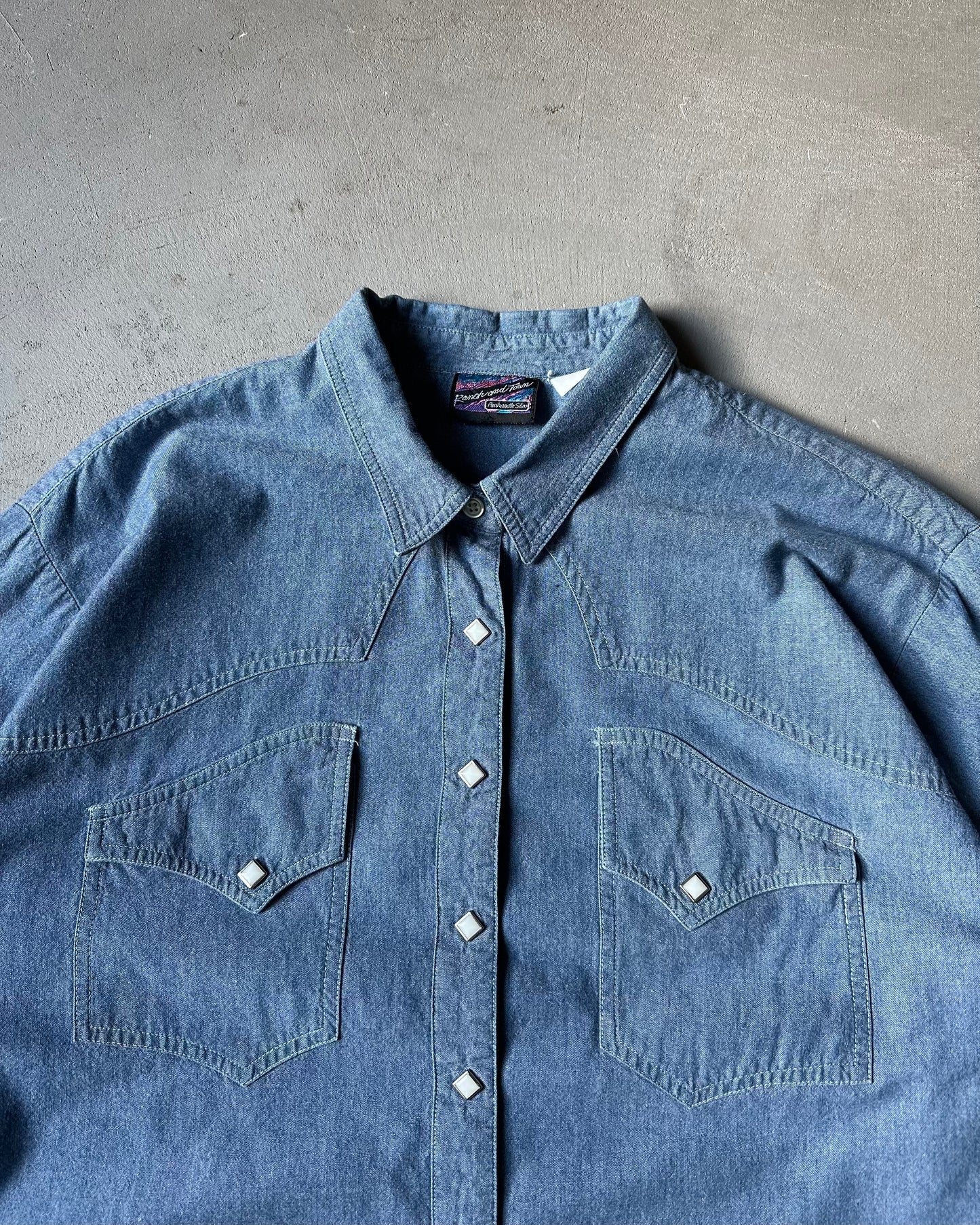 1980s - Blue Chambray Pearl Snap Shirt - (W)XL