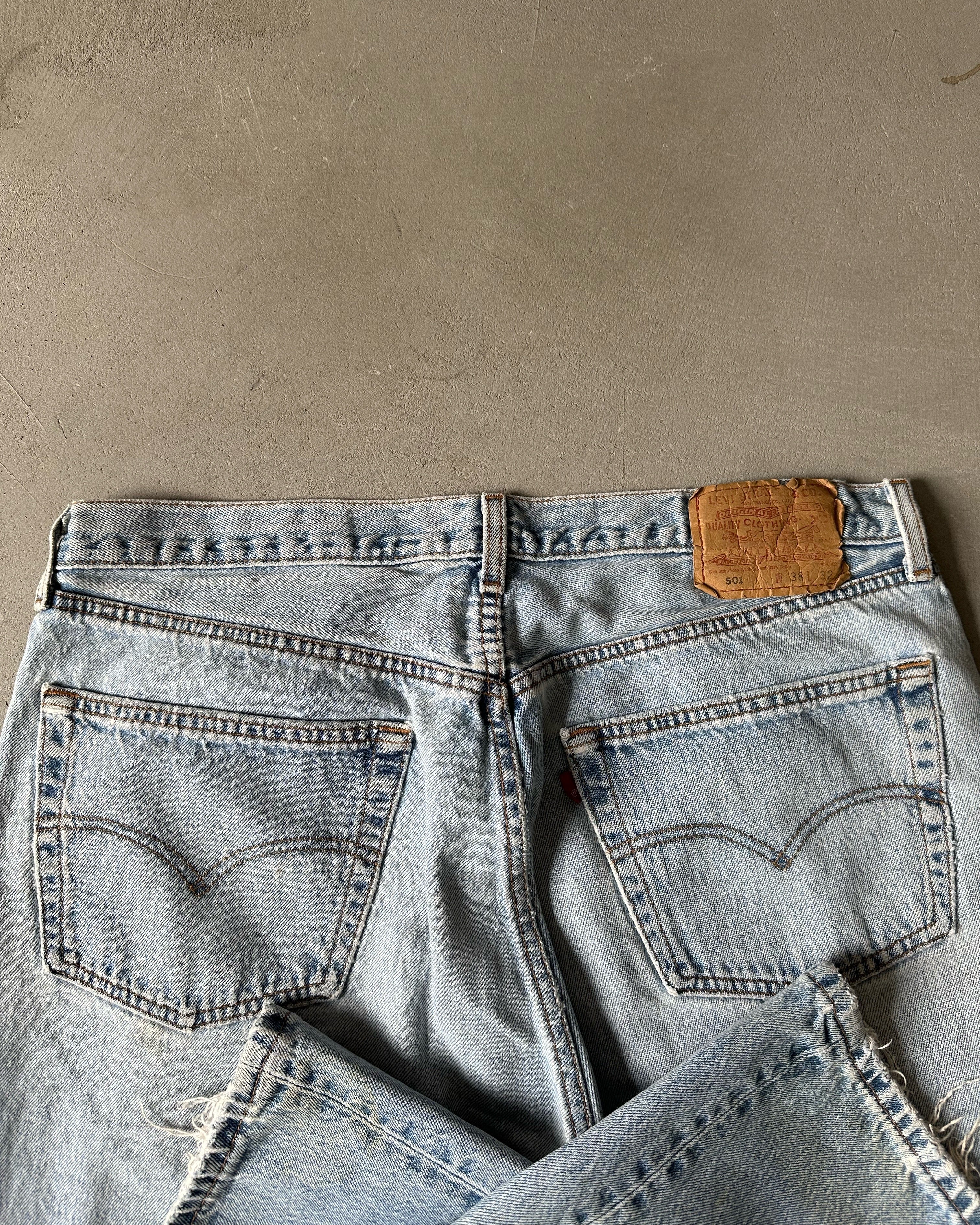 Distressed 501 jeans best sale